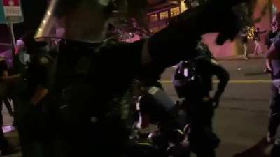 Another video from the protests in Portland, Or last night. It shows Portland police officers running after a civilian before tackling them and repeatedly punching them in the face while the man screams "I'm on the ground I'm not fighting back"-officers s