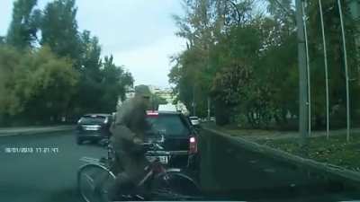 Just a man riding his bike