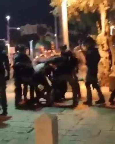 Israeli forces assaulting Palestinians, including girls, Haifa.
