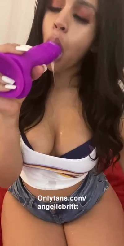 Sucking on a dildo