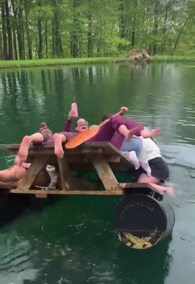 HMC while swimming with a picnic table.