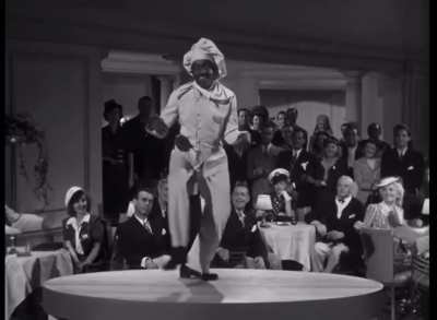 The Ink Spots, a jazz/doo-wop group that presaged R&amp;amp;B and Rock and Roll, are joined by equally famous dance trio of the era known as Tip, Tap and Toe. Together they perform the song "Shout Brother Shout", in the 1942 film "Pardon my Sarong".