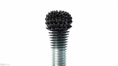 Ferrofluid, a colloidal magnetic liquid, being poured onto different magnets.