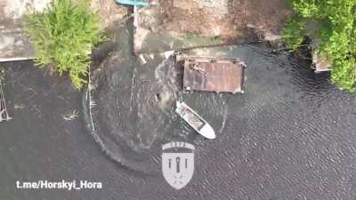 Drone dropped grenade strike lands near a Russian boat sending occupants into a panic, follow up strikes decimate multiple soldiers. Video by Horskyi Hora.