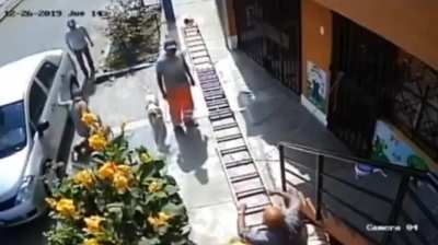 Evil Man in a wheelchair shakes the ladder because it is 'blocking the pavement' causing him to fall 30ft to the ground 
