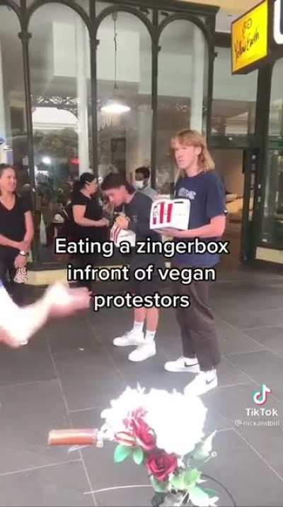 Eating a ZingerBox infront of vegan protestor's.