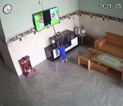Boy destroys TV after trying to catch object on screen