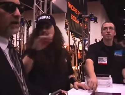 Dimebag Darrell refuses to sign guitar unless the "N***er can play it"