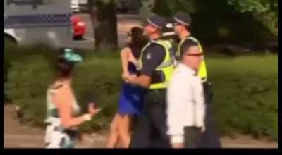 Lady is very surprised that she gets in trouble for pushing Policeman in a bush at Australian horseracing