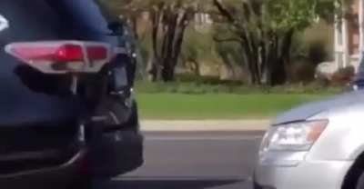 Yelling at protesters instead of focusing on the road