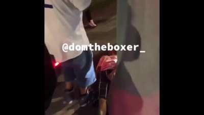 A crowd of people BEATING UP a disabled driver and destroying his car because he got into an accident with someone doing donuts at an intersection in LA.
