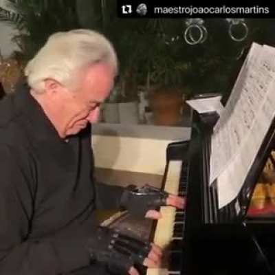 Wholesome moment: Brazilian maestro Jo&atilde;o Carlos Martins uses bionic gloves to play the piano after 22 years. He's lost movement of his fingers after two accidents and 24 surgeries.