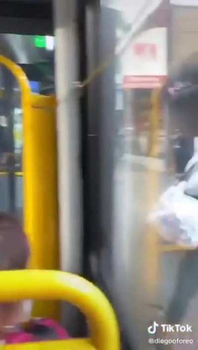 Anti-masker spits on the wrong bus rider... Bus rider quickly shows her the exit.