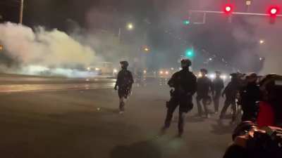 Protest from east Portland, Or- on 9/7- after once again attacking the crowd police chase down people while heckling them. This police officer tells a protestor they're &ldquo;hiding behind the press like a coward&rdquo;