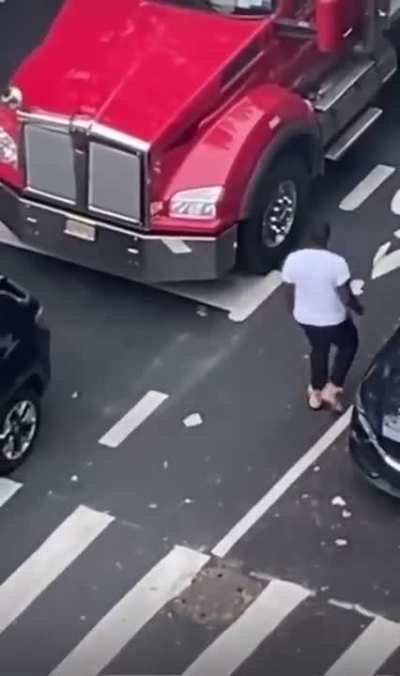 Impatient Trucker Honks His Horn So The Other Driver Reacts By Getting Out His Car and Dancing