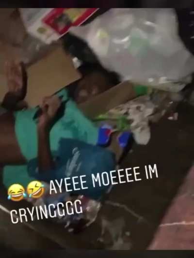 This group of men thought it was funny to throw this woman into a dumpster.