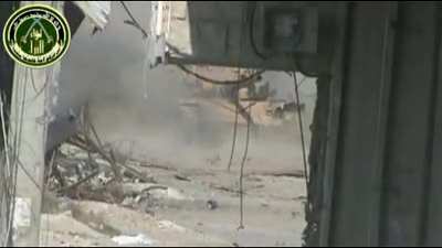 Liwa al-Bara fighters target a Syrian Army tank with a recoilless rifle - Damascus - 12/5/12