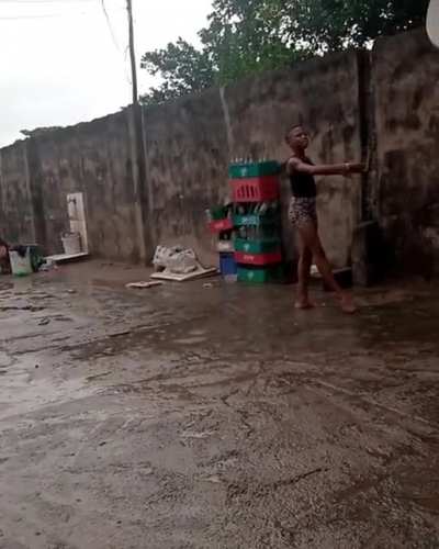 Anthony from Nigeria Dancing ballet barefooted on concrete while raining.