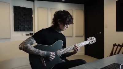 Tim Henson of Polyphia, performing "Playing God" unplugged. 