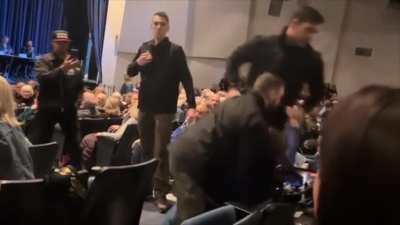 Woman dragged from north Idaho Republican townhall by unknown, allegedly-hired security for allegedly "verbally-attacking the legislators". Local Republican officials later could not identify the security company hired.