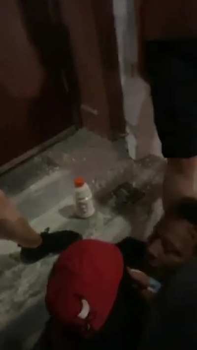 Looters knock out an old man who was defending his store with a fire extinguisher