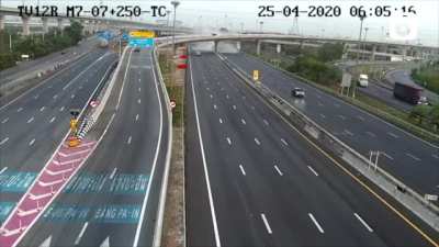 A speeding truck crashes off a flyover