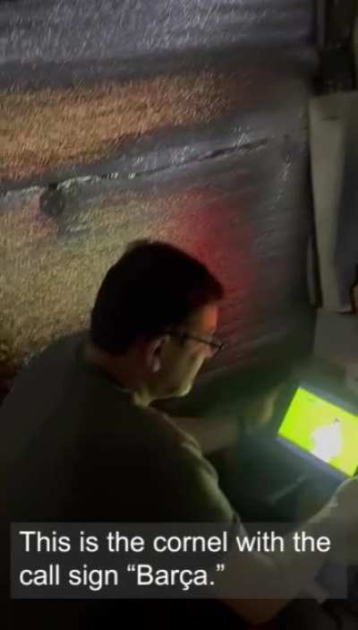 Carry on: Ukrainian defender watching a Bar&ccedil;a game in a bunker at the front