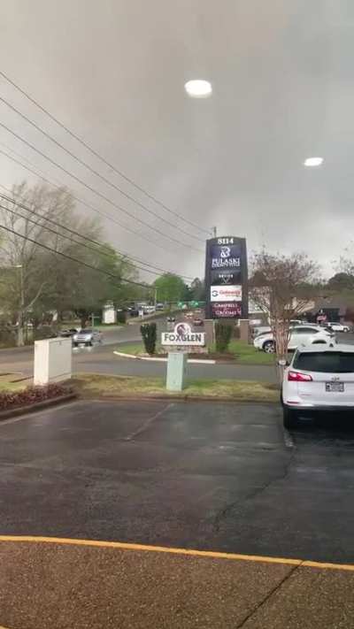 Woman from Little Rock, Arkansas takes direct hit from tornado. Sucked from building into parking lot.
