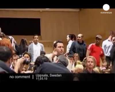 Lars Vilks lecture on the limits of freedom of expression in the arts erupts in violence as he shows the first clip, Uppsala University, Sweden.
