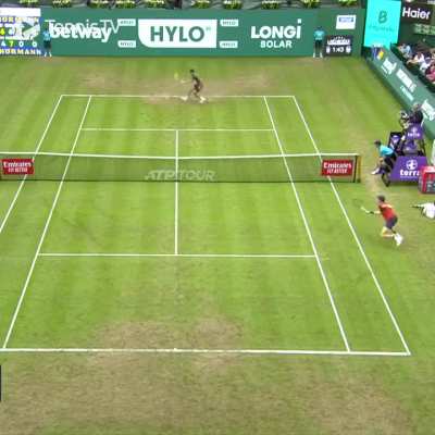Jannik Sinner with another point of the year contender. He dives and rolls to stay in the point. He follows it up with a backhand passing shot and ends up completely off the court.
