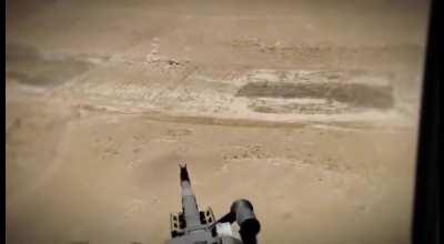A machine gunner fires at a fleeing ISIS pickup truck. Anbar desert, 2020