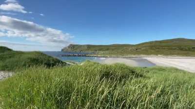Coral Sand Mountain and beach in far north of Norway on the Island of Soroya.