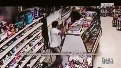Robber pulls out machete; Clerk pulls out sword