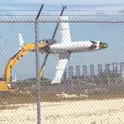 Excavator operator is having fun on a scrapyard