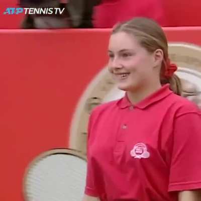 Goran Ivani&scaron;ević hands his racquet to a 14-yearl-old ball girl after he's unable to face his opposition.