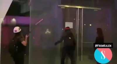 Rioters break windows in downtown Los Angeles October 6