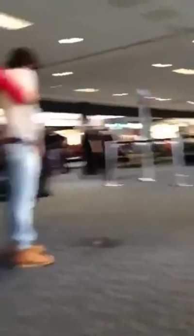 Guy pees on the floor in the airport