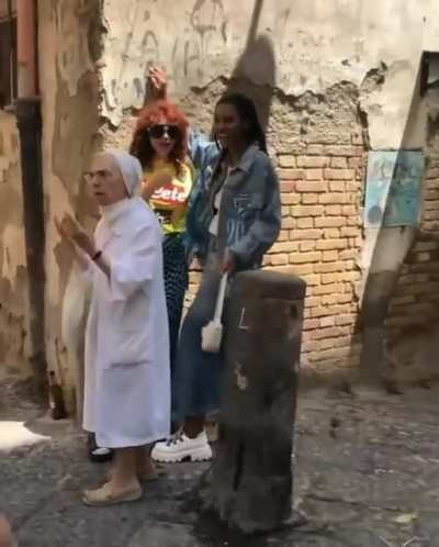 Nun pulls apart girls kissing during photo shoot in Naples