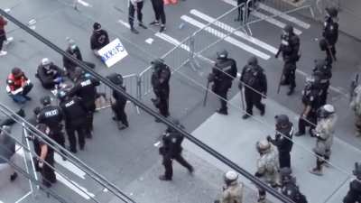 Seattle police purposely trying to provoke the peaceful demonstrators by pushing the barrier against them (13 and Pine, 8:58 PM)
