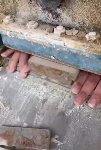 Guy Cutting Bricks