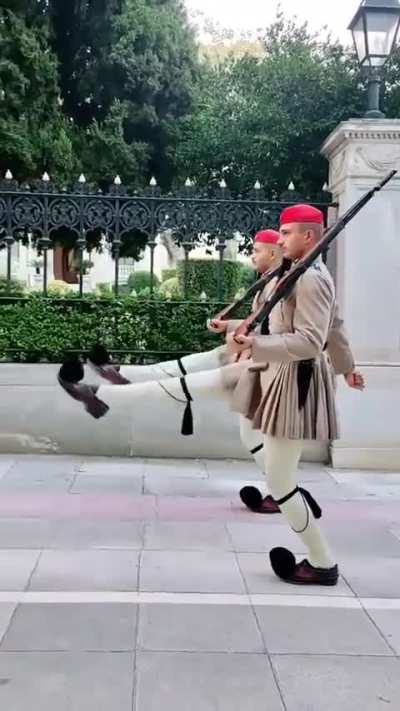 The Evzones are the Presidential Guard of Greece. An evzone must stand at least 1.87 meters tall, it&rsquo;s preferable for their knees to touch as they stand upright, and they must be fit enough to raise their legs to shoulder height, completely straight, as t