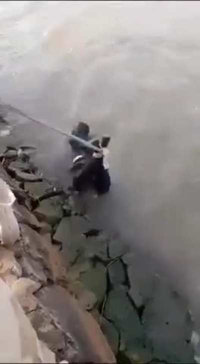Sudanese janjaweed fighters torturing a traitor
