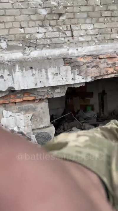 Ukrainian soldiers advance through the ruins of Bakhmut April 2023