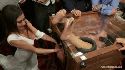 Girl locked in glass box fisted while squirting all over.