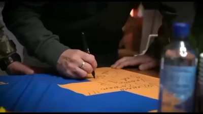 Zelensky Signs SS Nazi Flag 