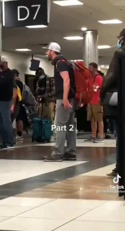 Antimask dumbfuck has a meltdown at the airport and demands that people rIsE uP!