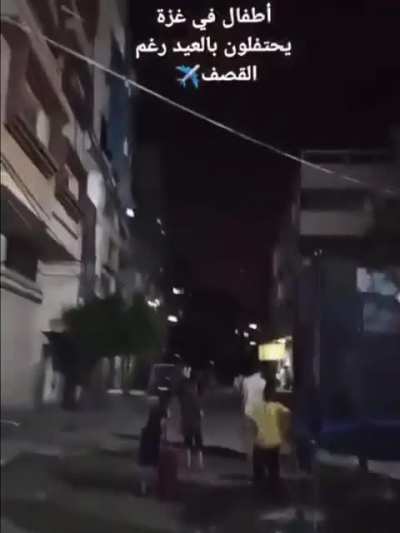 &mdash; Children in Gaza currently still playing during massive ongoing bombardments