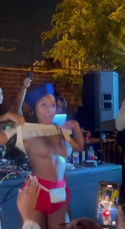 Janelle Monae flashing at a concert