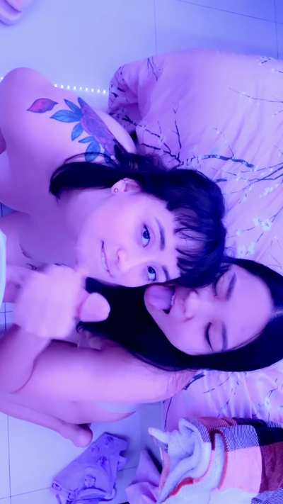 Two Asian girls getting a sexy facial