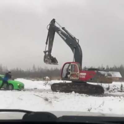 Guys' car gets crushed because they tried beating up the excavator operator